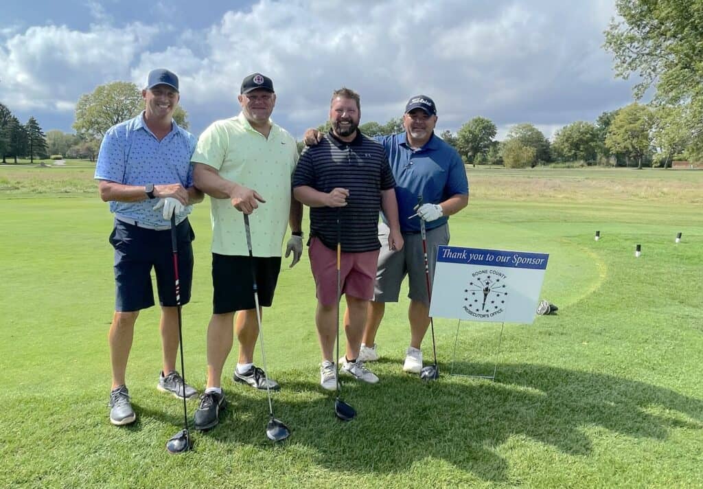 Golfers pose at the 2024 outing