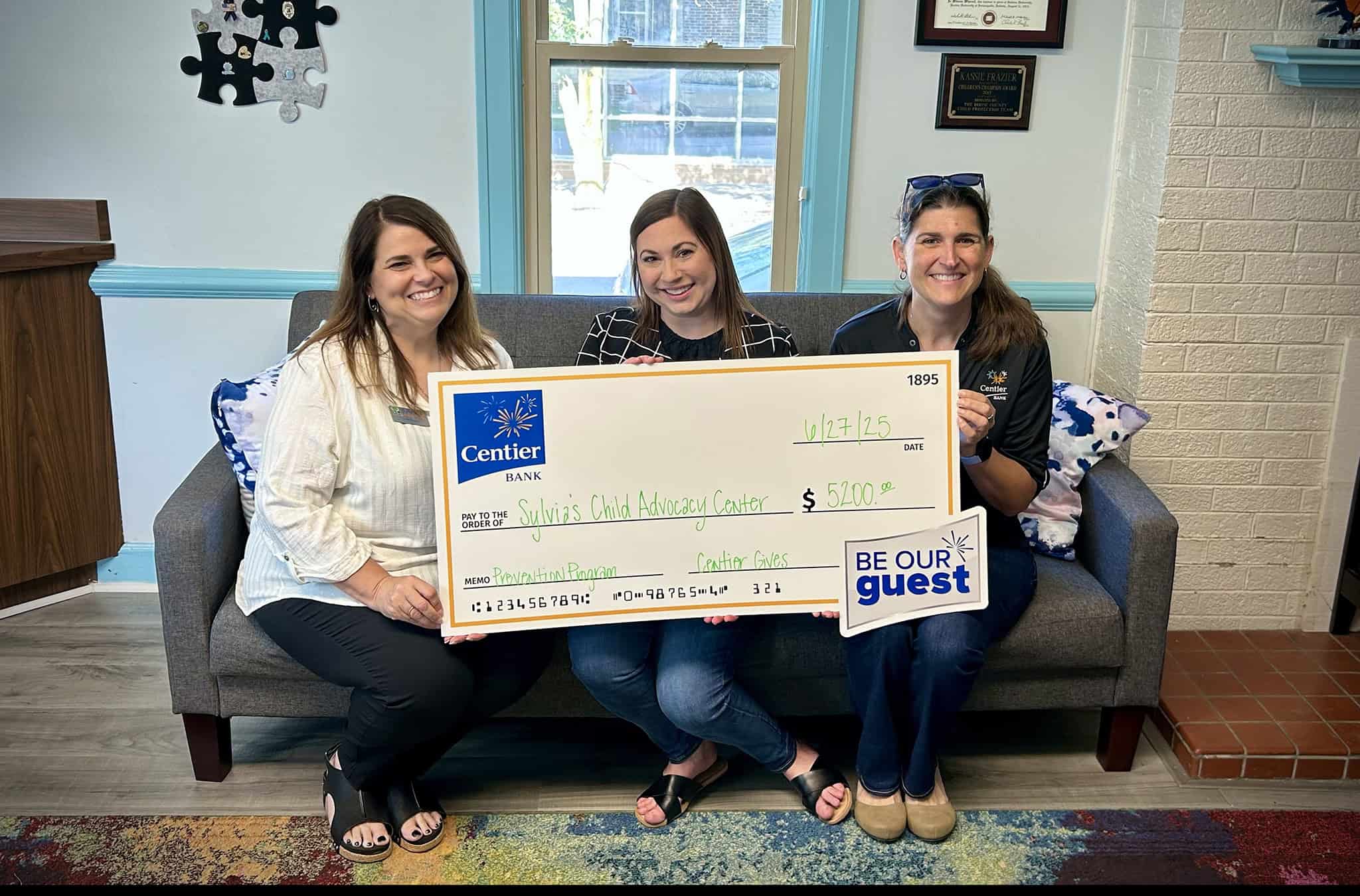 Centier Bank representatives present a check for $5,200 to Sylvia's CAC