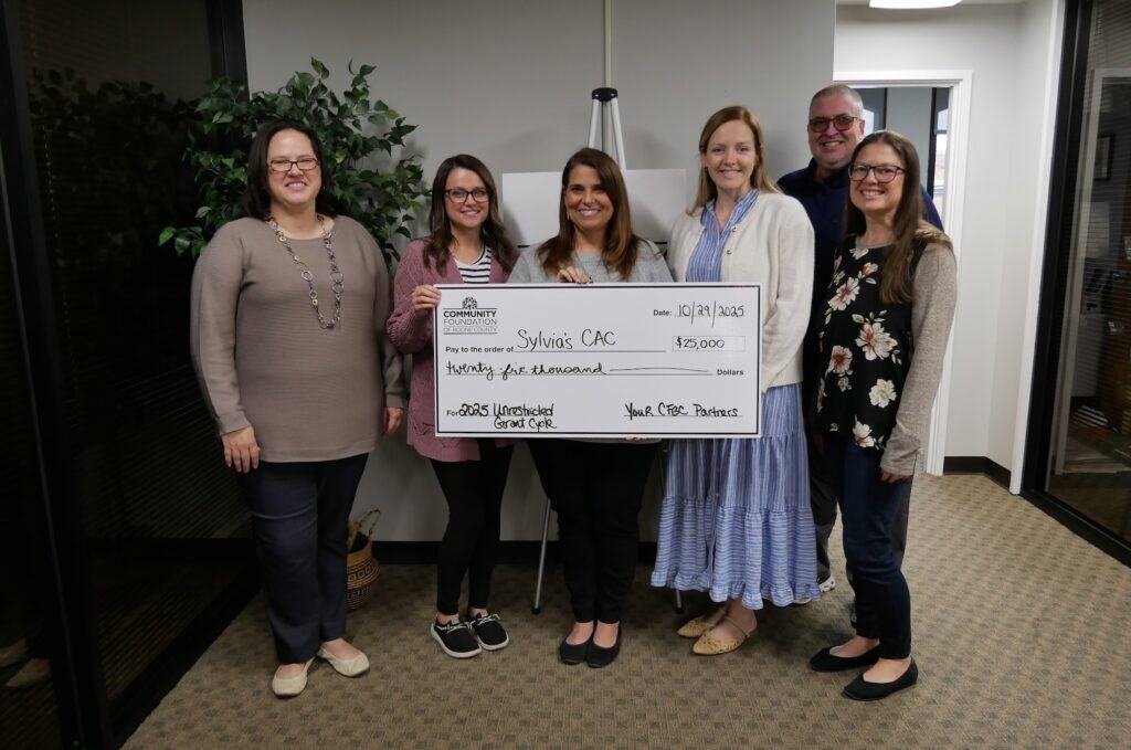 Staff at the Community Foundation of Boone County pose with CAC staff receiving a large check.